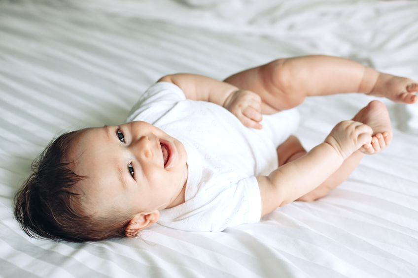 baby using primitive reflex to roll 