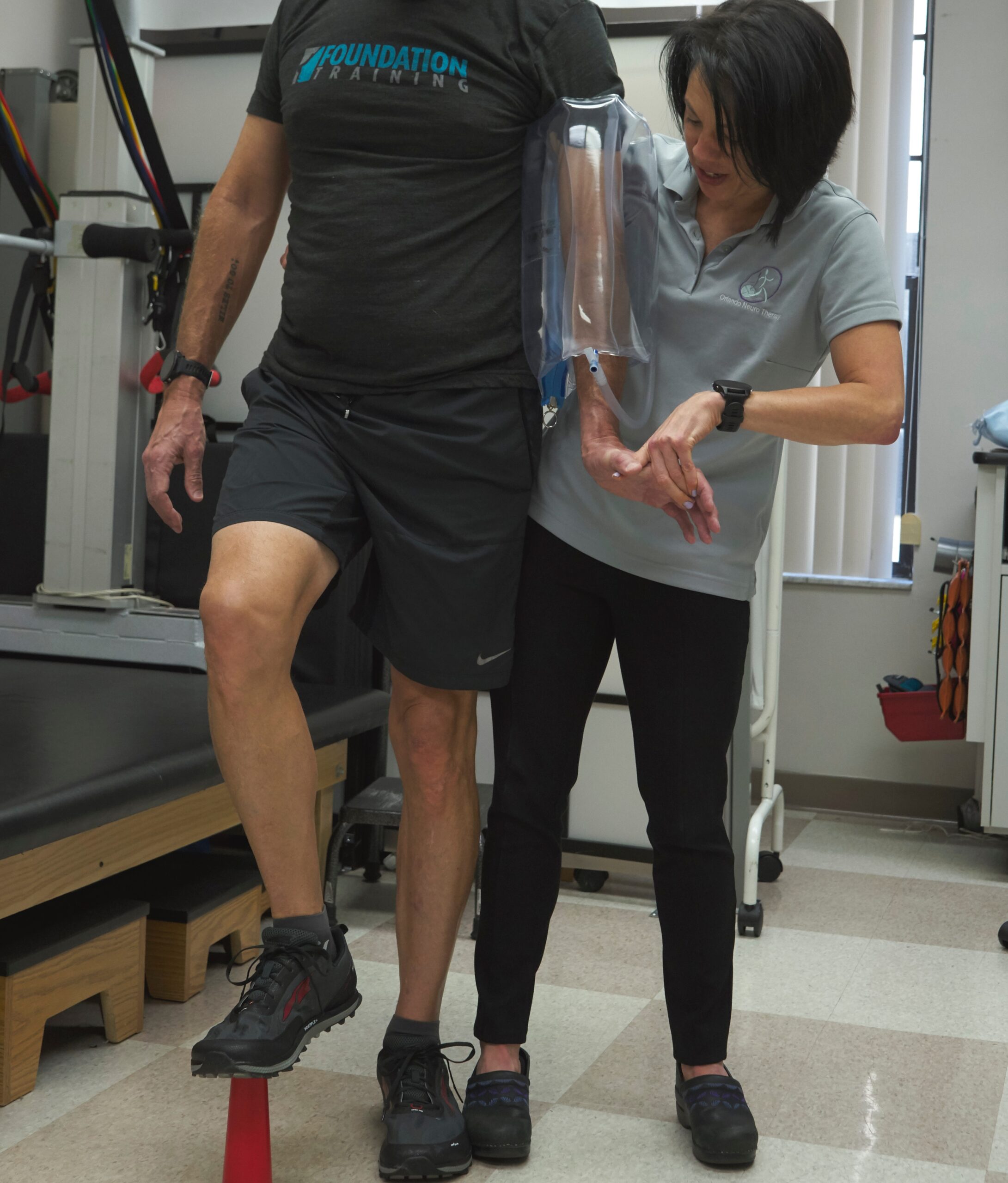 therapist working with the urias air splint on in standing