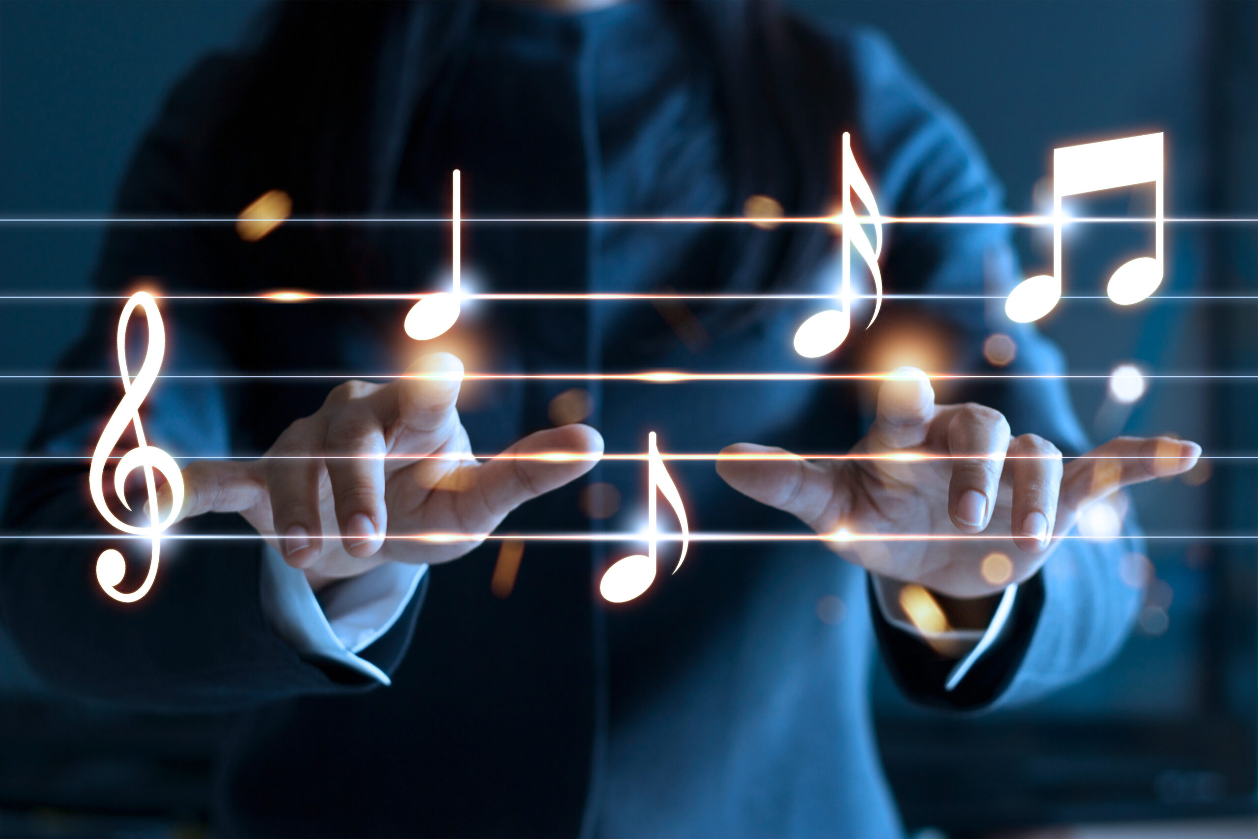 finger pointing toward music notes