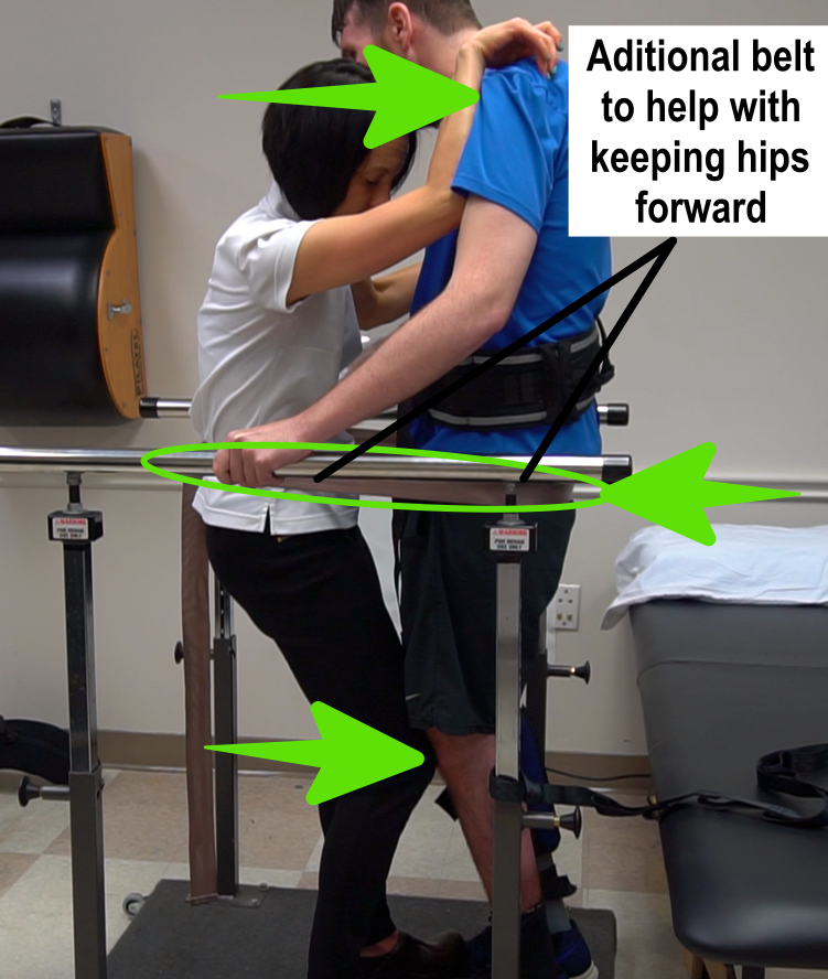 female assisting male with standing
